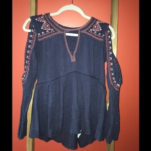 Blue long sleeve with shoulder cutouts.